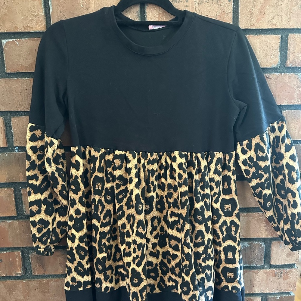 Boutique dress. Right above knee length. 3/4 sleeve. Worn once!